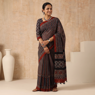 Multicolor Natural Dyed Hand Block Print Modal Silk Ajrakh Saree with Tassels, draped and worn by a woman, AI visual of the saree, iTokri