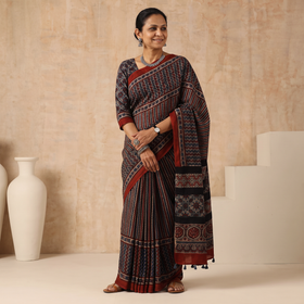 Multicolor Natural Dyed Hand Block Print Modal Silk Ajrakh Saree with Tassels, draped and worn by a woman, AI visual of the saree, iTokri