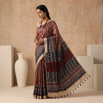Multicolor Natural Dyed Hand Block Print Modal Silk Ajrakh Saree with Tassels, draped and worn by a woman, AI visual of the saree, iTokri