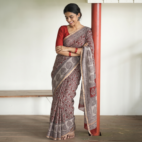 Beige Natural Dyed Kota Doria Cotton Hand Block Bagh Print Saree, draped and worn by a woman, AI visual of the saree, iTokri