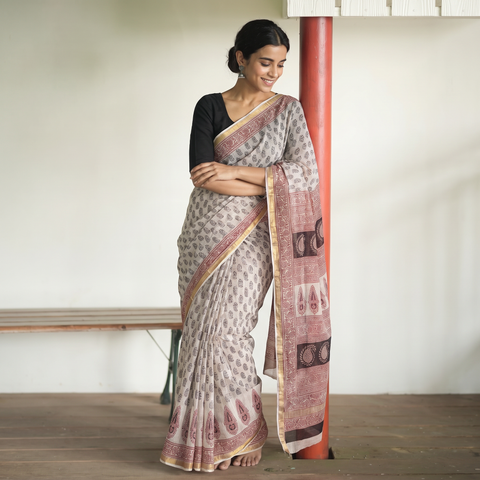 Beige Natural Dyed Kota Doria Cotton Hand Block Bagh Print Saree, draped and worn by a woman, AI visual of the saree, iTokri