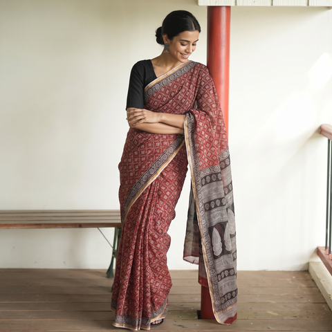 Red Natural Dyed Kota Doria Cotton Hand Block Bagh Print Saree, draped and worn by a woman, AI visual of the saree, iTokri