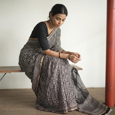 Black Natural Dyed Kota Doria Cotton Hand Block Bagh Print Saree, draped and worn by a woman, AI visual of the saree, iTokri