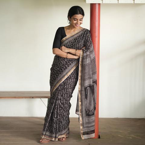 Black Natural Dyed Kota Doria Cotton Hand Block Bagh Print Saree, draped and worn by a woman, AI visual of the saree, iTokri