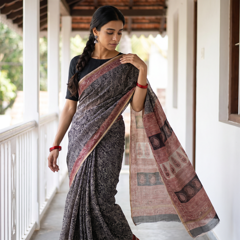Black Natural Dyed Kota Doria Cotton Hand Block Bagh Print Saree, draped and worn by a woman, AI visual of the saree, iTokri