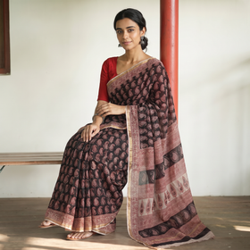Black Natural Dyed Kota Doria Cotton Hand Block Bagh Print Saree, draped and worn by a woman, AI visual of the saree, iTokri
