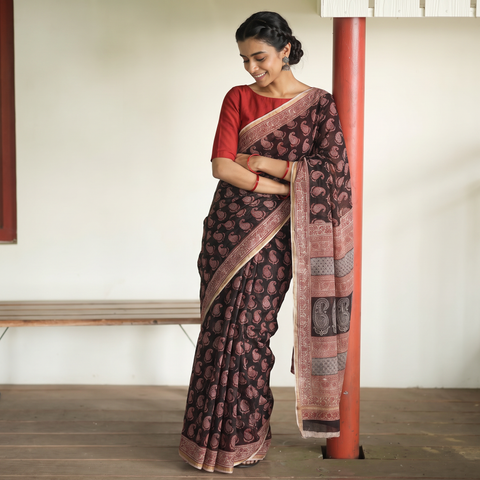 Black Natural Dyed Kota Doria Cotton Hand Block Bagh Print Saree, draped and worn by a woman, AI visual of the saree, iTokri