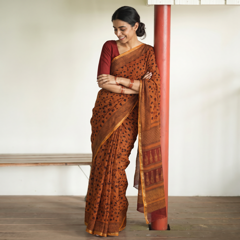 Orange Natural Dyed Kota Doria Cotton Hand Block Bagh Print Saree, draped and worn by a woman, AI visual of the saree, iTokri