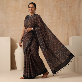 Brown Natural Dyed Modal Silk Kutch Hand Block Print Ajrakh Saree, draped and worn by a woman, AI visual of the saree, iTokri