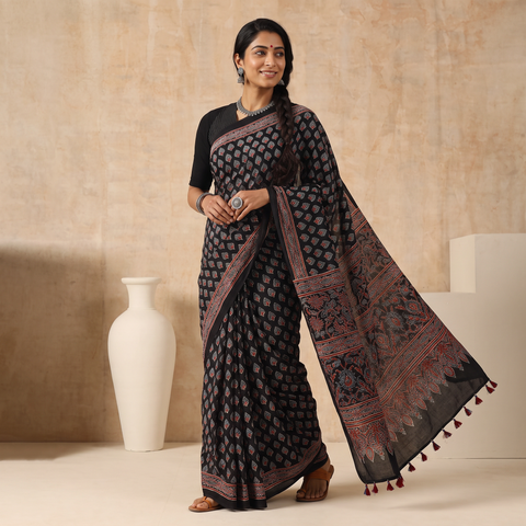 Black Natural Dyed Modal Silk Kutch Hand Block Print Ajrakh Saree, draped and worn by a woman, AI visual of the saree, iTokri
