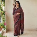 Red Natural Dyed Modal Silk Kutch Hand Block Print Ajrakh Saree, draped and worn by a woman, AI visual of the saree, iTokri