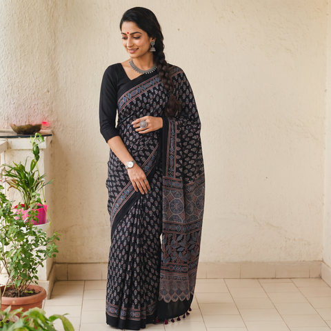 Black Natural Dyed Modal Silk Kutch Hand Block Print Ajrakh Saree, draped and worn by a woman, AI visual of the saree, iTokri