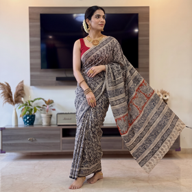 Black Natural Dyed Pedana Block Print Cotton Kalamkari Saree, draped and worn by a woman, AI visual of the saree, iTokri