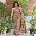 Beige Natural Dyed Pedana Block Print Cotton Kalamkari Saree, draped and worn by a woman, AI visual of the saree, iTokri