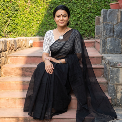 Black Nazaakat Kota Doria Cotton Plain Saree with Blouse & Jewellery Set, draped and worn by a woman, AI visual of the saree, iTokri