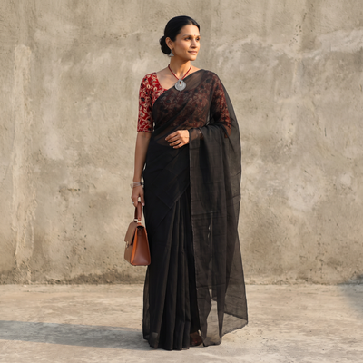 Black Nazaakat Kota Doria Cotton Plain Saree with Blouse & Jewellery Set, draped and worn by a woman, AI visual of the saree, iTokri