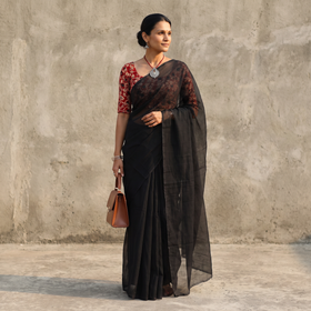 Black Nazaakat Kota Doria Cotton Plain Saree with Blouse & Jewellery Set, draped and worn by a woman, AI visual of the saree, iTokri
