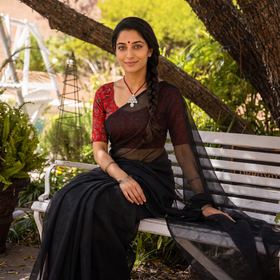 Black Nazaakat Kota Doria Cotton Plain Saree with Blouse & Jewellery Set, draped and worn by a woman, AI visual of the saree, iTokri