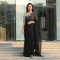 Black Nazaakat Kota Doria Cotton Plain Saree with Blouse & Jewellery Set, draped and worn by a woman, AI visual of the saree, iTokri