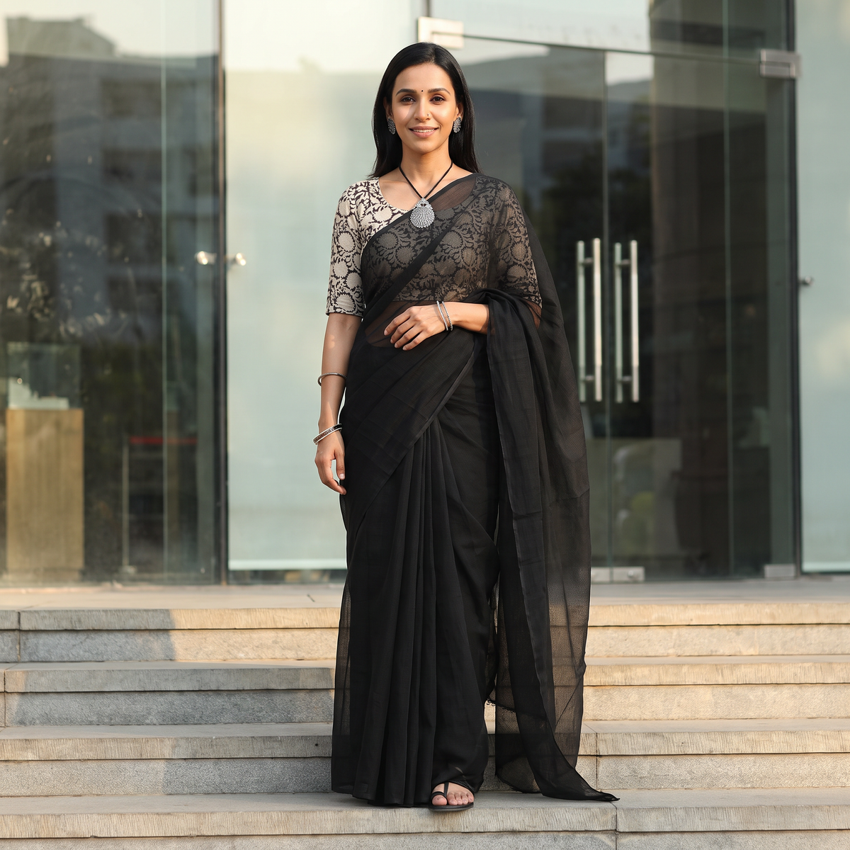 Black Nazaakat Kota Doria Cotton Plain Saree with Blouse & Jewellery Set, draped and worn by a woman, AI visual of the saree, iTokri
