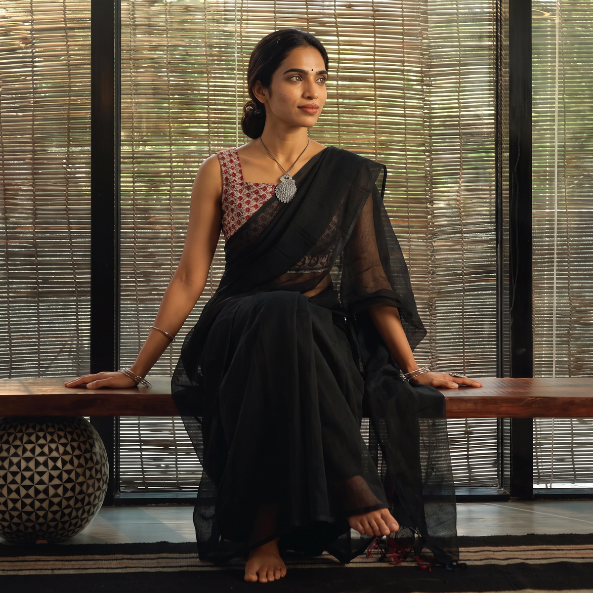 Black Nazaakat Kota Doria Cotton Plain Saree with Blouse & Jewellery Set, draped and worn by a woman, AI visual of the saree, iTokri