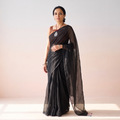 Black Nazaakat Kota Doria Cotton Plain Saree with Blouse & Jewellery Set, draped and worn by a woman, AI visual of the saree, iTokri