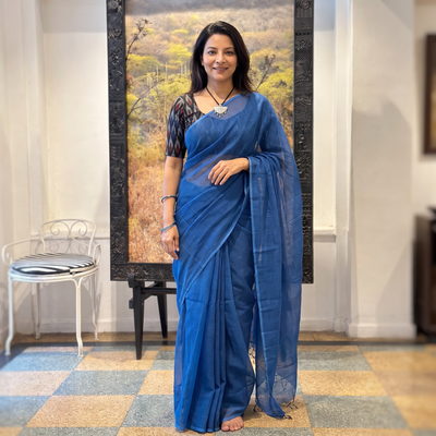 Blue Nazaakat Kota Doria Cotton Plain Saree with Blouse & Jewellery Set, draped and worn by a woman, AI visual of the saree, iTokri