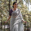 Grey Nazaakat Kota Doria Cotton Plain Saree with Blouse & Jewellery Set, draped and worn by a woman, AI visual of the saree, iTokri