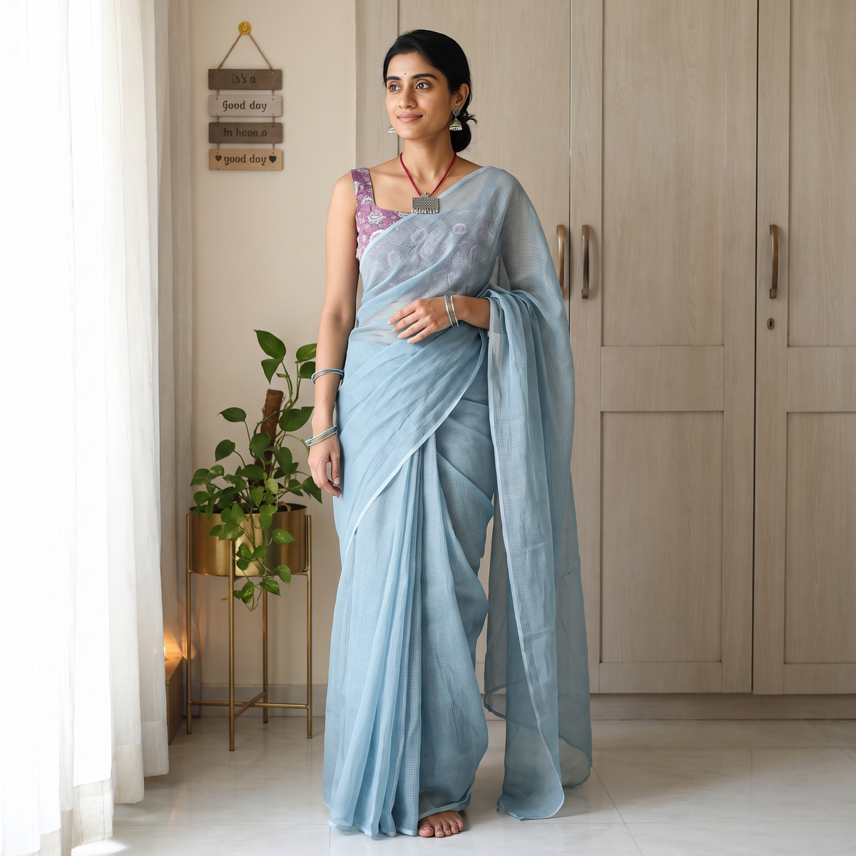Blue Nazaakat Kota Doria Cotton Plain Saree with Blouse & Jewellery Set, draped and worn by a woman, AI visual of the saree, iTokri