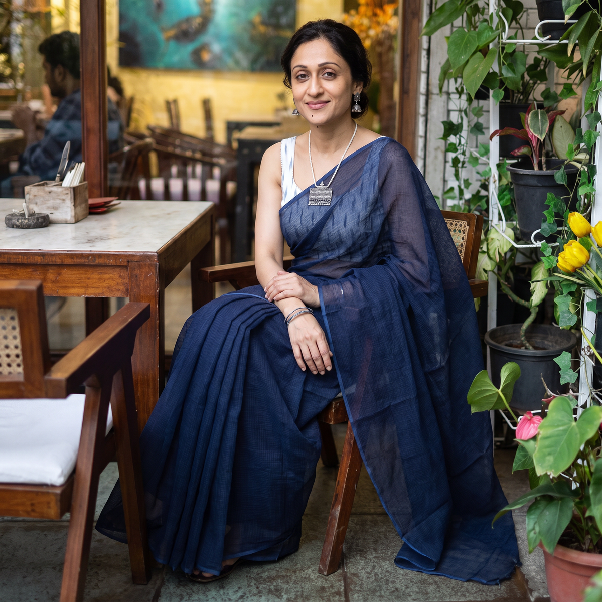 Blue Nazaakat Kota Doria Cotton Plain Saree with Blouse & Jewellery Set, draped and worn by a woman, AI visual of the saree, iTokri