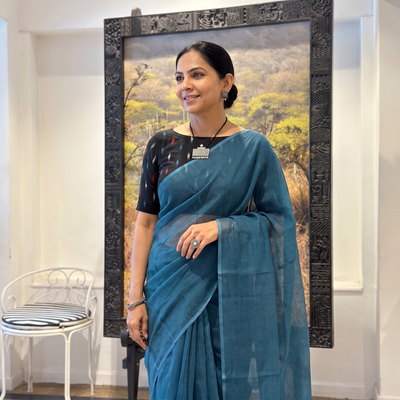 Blue Nazaakat Kota Doria Cotton Plain Saree with Blouse & Jewellery Set, draped and worn by a woman, AI visual of the saree, iTokri