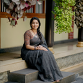 Grey Nazaakat Kota Doria Cotton Plain Saree with Blouse & Jewellery Set, draped and worn by a woman, AI visual of the saree, iTokri