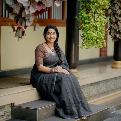 Grey Nazaakat Kota Doria Cotton Plain Saree with Blouse & Jewellery Set, draped and worn by a woman, AI visual of the saree, iTokri