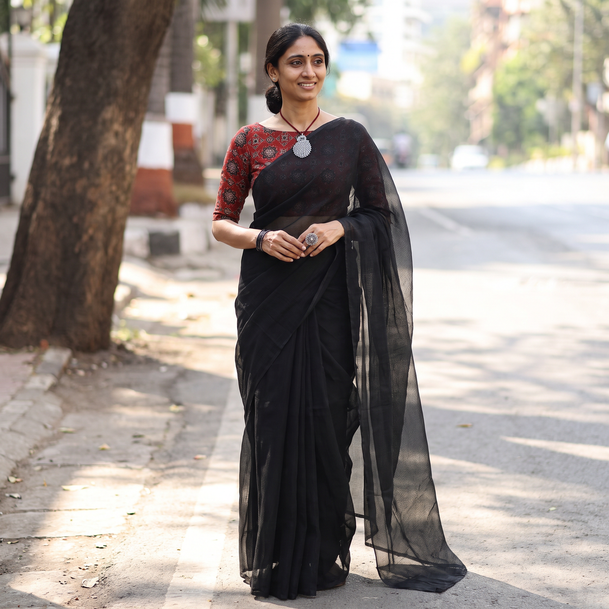 Black Nazaakat Kota Doria Cotton Plain Saree with Blouse & Jewellery Set, draped and worn by a woman, AI visual of the saree, iTokri