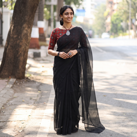Black Nazaakat Kota Doria Cotton Plain Saree with Blouse & Jewellery Set, draped and worn by a woman, AI visual of the saree, iTokri