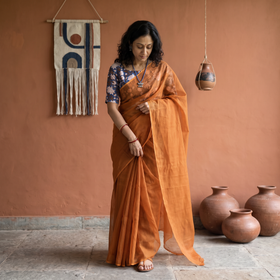 Orange Nazaakat Kota Doria Cotton Plain Saree with Blouse & Jewellery Set, draped and worn by a woman, AI visual of the saree, iTokri