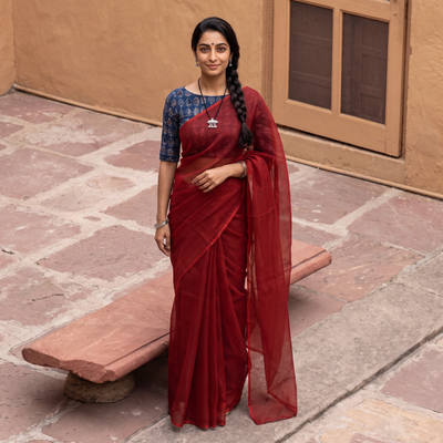 Red Nazaakat Kota Doria Cotton Plain Saree with Blouse & Jewellery Set, draped and worn by a woman, AI visual of the saree, iTokri