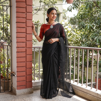 Black Nazaakat Kota Doria Cotton Plain Saree with Blouse & Jewellery Set, draped and worn by a woman, AI visual of the saree, iTokri