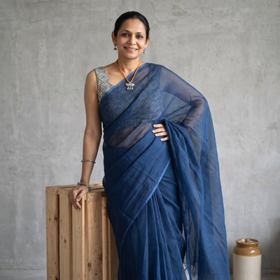 Blue Nazaakat Kota Doria Cotton Plain Saree with Blouse & Jewellery Set, draped and worn by a woman, AI visual of the saree, iTokri