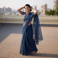 Blue Nazaakat Kota Doria Cotton Plain Saree with Blouse & Jewellery Set, draped and worn by a woman, AI visual of the saree, iTokri