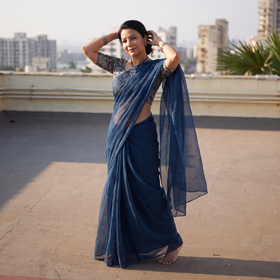 Blue Nazaakat Kota Doria Cotton Plain Saree with Blouse & Jewellery Set, draped and worn by a woman, AI visual of the saree, iTokri