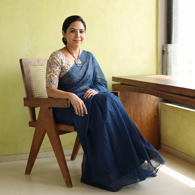 Blue Nazaakat Kota Doria Cotton Plain Saree with Blouse & Jewellery Set, draped and worn by a woman, AI visual of the saree, iTokri