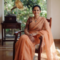 Peach Nazaakat Kota Doria Cotton Plain Saree with Blouse & Jewellery Set, draped and worn by a woman, AI visual of the saree, iTokri