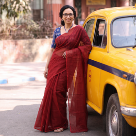 Red Nazaakat Kota Doria Cotton Plain Saree with Blouse & Jewellery Set, draped and worn by a woman, AI visual of the saree, iTokri