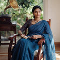 Blue Nazaakat Kota Doria Cotton Plain Saree with Blouse & Jewellery Set, draped and worn by a woman, AI visual of the saree, iTokri