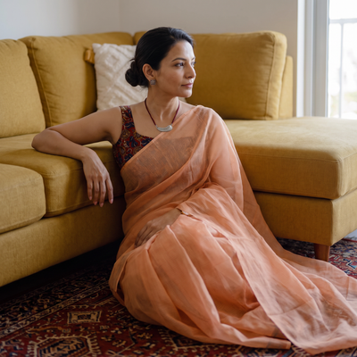 Peach Nazaakat Kota Doria Cotton Plain Saree with Blouse & Jewellery Set, draped and worn by a woman, AI visual of the saree, iTokri