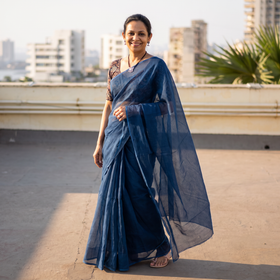 Blue Nazaakat Kota Doria Cotton Plain Saree with Blouse & Jewellery Set, draped and worn by a woman, AI visual of the saree, iTokri