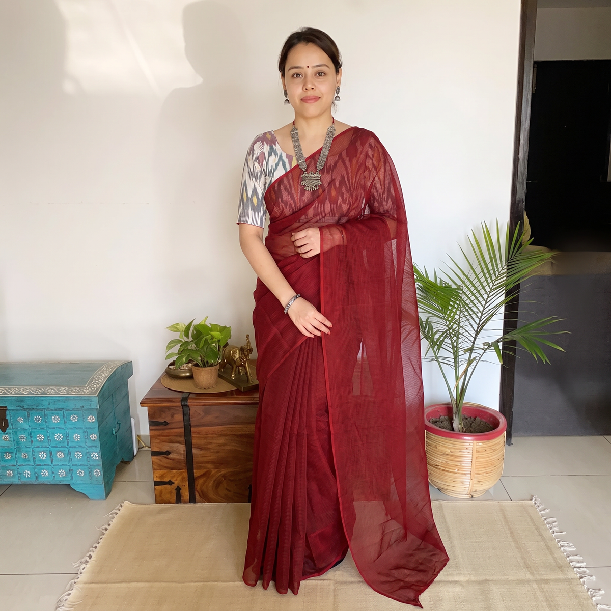 Red Nazaakat Kota Doria Cotton Plain Saree with Blouse & Jewellery Set, draped and worn by a woman, AI visual of the saree, iTokri