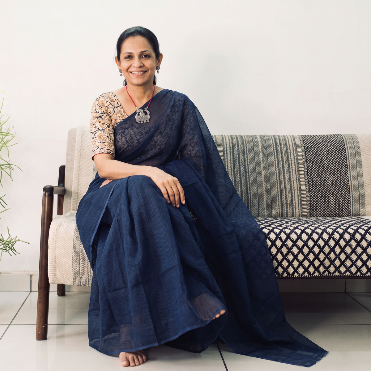 Blue Nazaakat Kota Doria Cotton Plain Saree with Blouse & Jewellery Set, draped and worn by a woman, AI visual of the saree, iTokri