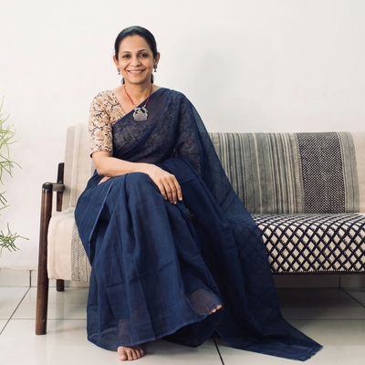 Blue Nazaakat Kota Doria Cotton Plain Saree with Blouse & Jewellery Set, draped and worn by a woman, AI visual of the saree, iTokri